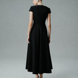 ASİMETRİK YAKA İŞLEME DETAYLI KLOŞ ETEKLİ MİDİ BOY KREP ELBİSE SİYAH